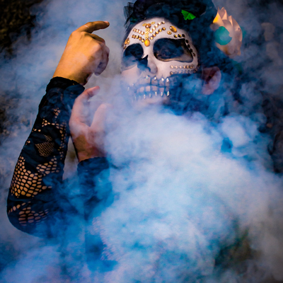 Haunt actor surrounded by smoke while receiving safety training